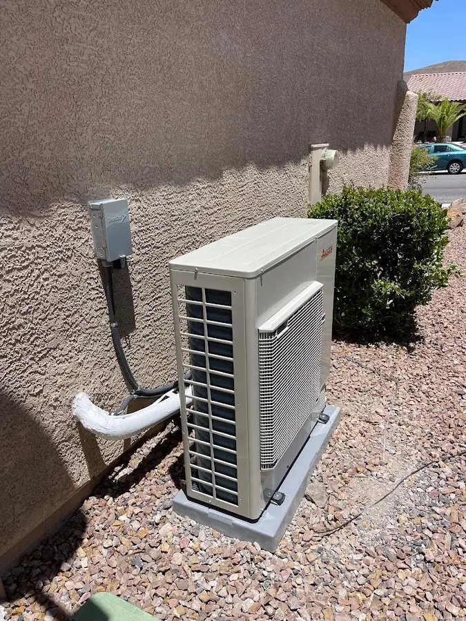 Residential air conditioning condenser unit in Farr West